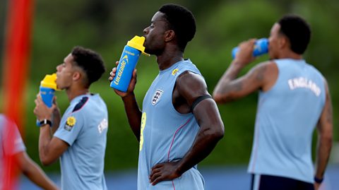 England players hydrate with electrolytes during the team's 2026 World Cup training camp.