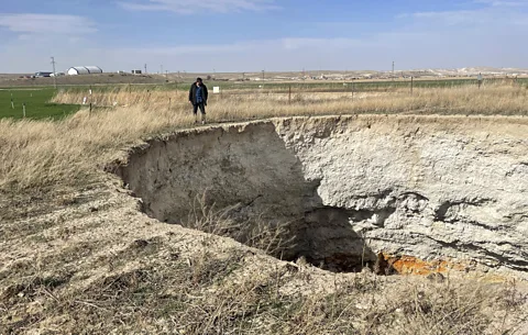 Katie Nadwony Sinkholes have already appeared on Konya's farmer Mehmet Akıf Işıklı's neighbour's land (Credit: Katie Nadwony)