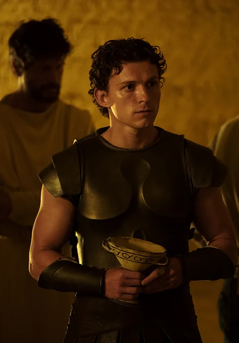 Universal Pictures Tom Holland plays Odysseus' son Telemachus – and like other British actors in the film, speaks in a US accent (Credit: Universal Pictures)