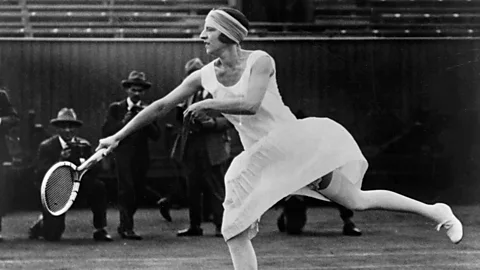 Getty Images In the 1920s French tennis star Suzanne Lenglen caused a sensation at the Championships with her Flapper-style dresses (Credit: Getty Images)