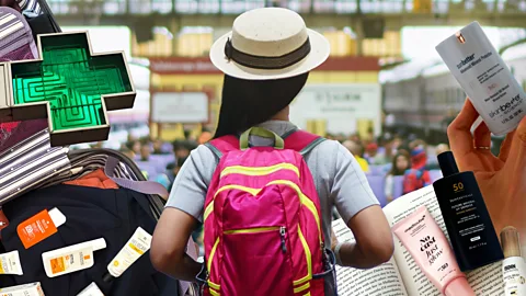 BBC/ Eva Sandoval/ Chriselle Lim A woman traveller from behind surrounded by a green pharmacy cross, a suitcase, a book and bottles of suncream (Credit: BBC / Eva Sandoval / AlignPR)