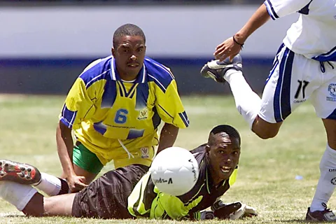 Getty Images Barbados goalkeeper Horace Strout lies on the floor face first and watches the ball in a later game against Grenada in 2002 (Credit: Getty Images)