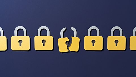 A series of padlocks, with the centre one broken. 