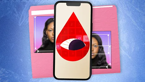 BBC/ Serenity Strull/ Getty Images A stylised graphic of a red blood drop containing an eye, displayed on a smartphone screen. Parts of a woman's face are seen on a file folder behind the smartphone (Credit: BBC/ Serenity Strull/ Getty Images)