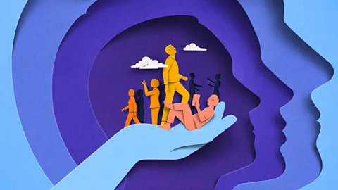Eiko Ojala An abstract illustration featuring paper cut-outs of people going about their work in the palm of someone’s hand (Credit: Eiko Ojala)