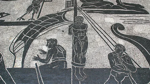 Getty Images A black-and-white mosaic showing the Greek hero Odysseus tied to a ship mast (Credit: Getty Images)