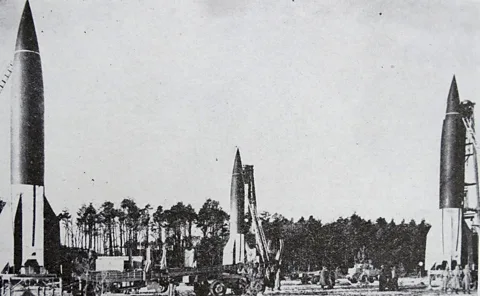 Getty Images A grainy, black and white photograph of three v2 rockets (Credit: Getty Images)