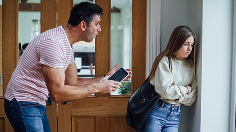 Dad argues with teenage daughter over mobile phone use.
