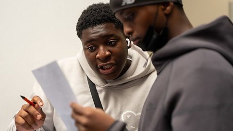 Students looking at GCSE results.