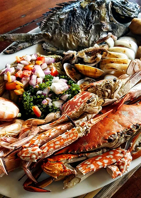 Andrew Zimmern Freshly caught seafood pulled up through a hole in the floor made this meal on Palawan Island both delicious and unforgettable (Credit: Andrew Zimmern)