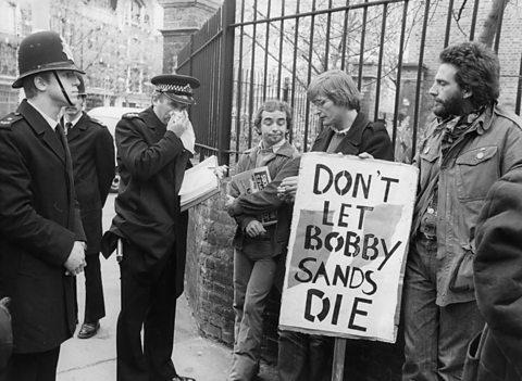  IRA sympathisers bearing banners on behalf of the hunger striker Bobby Sands, 1981.