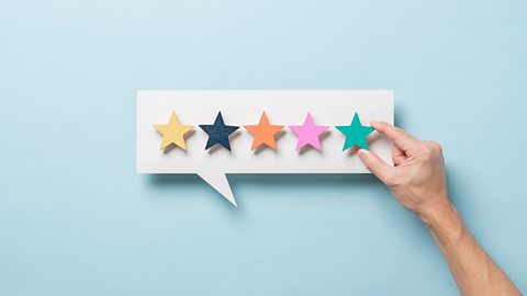 A speech bubble with five stars shown, indicating a rating.