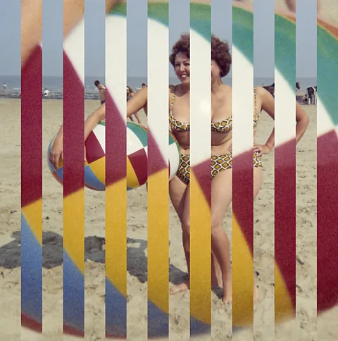 Edouard Taufenbach & Bastien Pourtout A stylised photo of a woman in a retro swimsuit holding a beach ball at the beach (Credit: Edouard Taufenbach & Bastien Pourtout)
