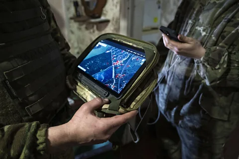 Getty Images Global positioning system (GPS) handsets like these in use by the Ukrainian armed forces are vulnerable to electronic jamming (Credit: Getty Images)