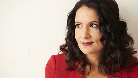 Dr Radha Modgil wearing a red jacket.
