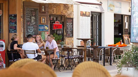 Alamy The custom of sobremesa makes a simple meal a social event (Credit: Getty Images)