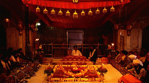 Reading from the Guru Granth Sahib inside the Golden Temple at Amritsar
