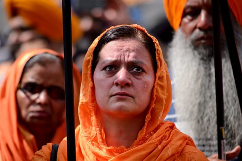 A Sikh woman cries during a demonstration in central London on June 8, 2014