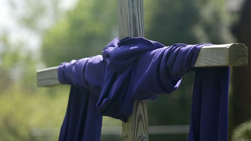 cross draped with purple cloth symbolising Lent