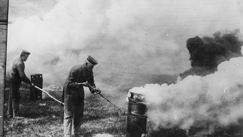 German soldiers stand downwind as they release poisonous gas