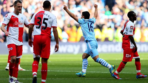 Sergio Aguero celebrates scoring the goal that won the league for Manchester City in 2012