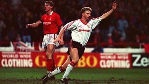 Mark Robins celebrates scoring for Manchester United.