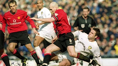 Dutch defender Jaap Stam playing for Manchester United.