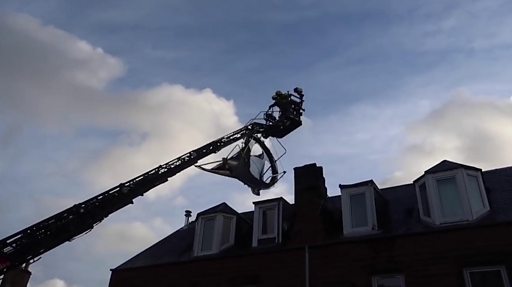 Firefighters rescue trampoline from roof of Galashiels house - BBC News