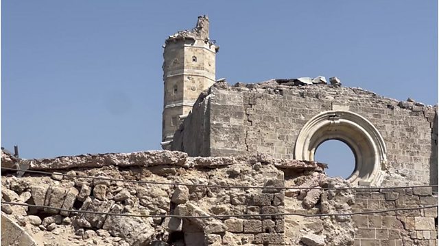 Photo shows ruins of the the Great Omari Mosque in Gaza against a blue sky