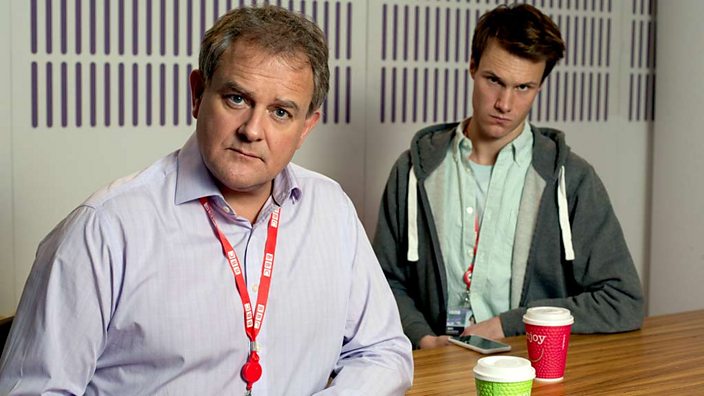 Hugh Skinner with Hugh Bonneville in W1A (credit BBC/Jack Barnes)