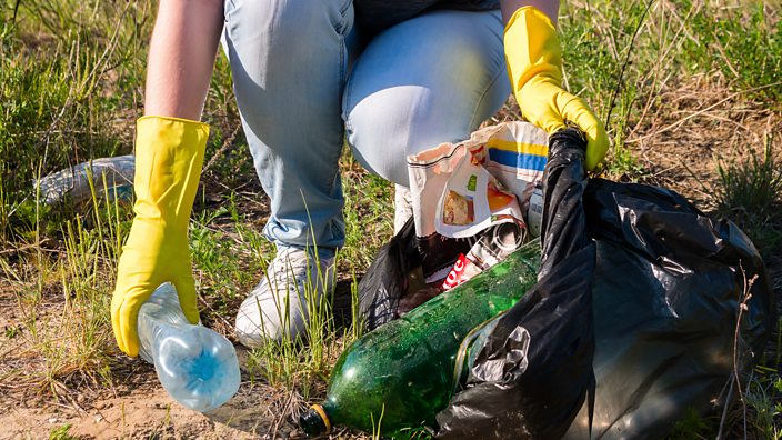 Someone cleaning up rubbish 