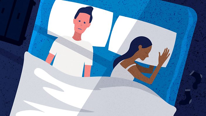 A couple in bed