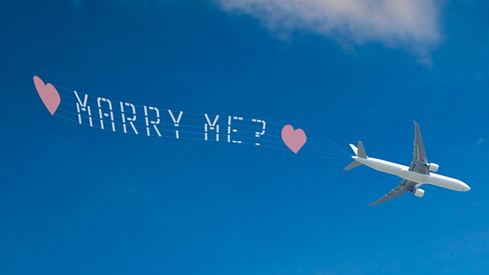 Aeroplane with Marry Me banner