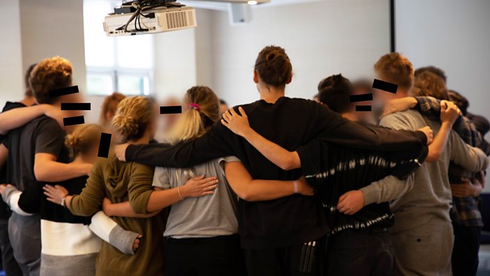 Kids embrace after a sharing circle at Yes We Can Youth Clinics