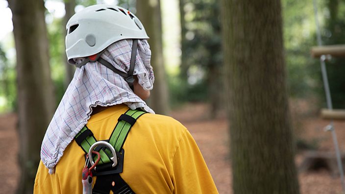 James prepares to tackle the tree top assault course blindfolded