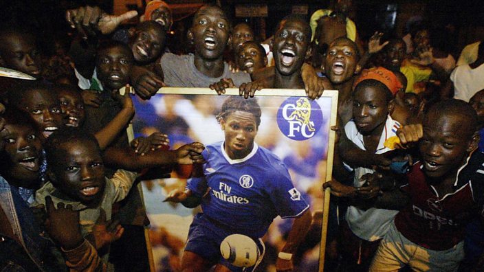 Fans in Ivory Coast with a Didier Drogba banner