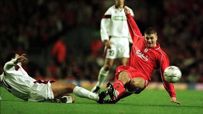 Steven Gerrard makes a trademark fierce tackle in midfield 