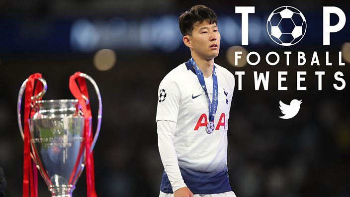 Son of Tottenham walks past the Champions League trophy