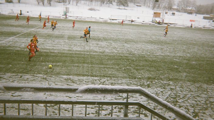 Players for Trondheims-orn play in the snow