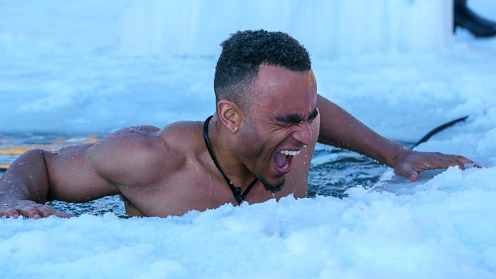 A photo of Munya submerging himself into ice water