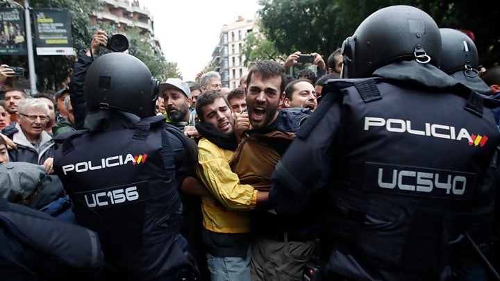 Riot police were seen using batons and kicking people to block voting