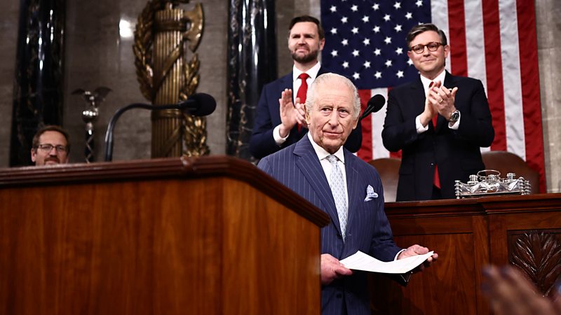 The King looks on during a speech in Congress as people clap