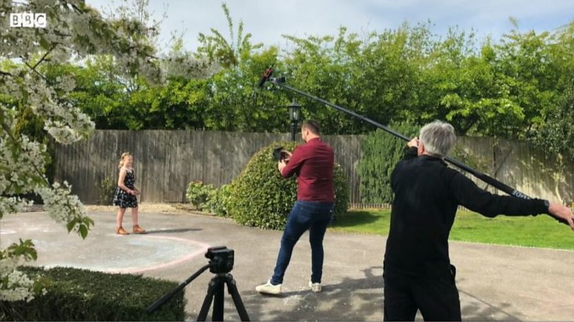 Cameraman Mike Buttery filming a contributor while his BBC Look North reporter colleague Phil Bodmer holds the boom pole and microphone