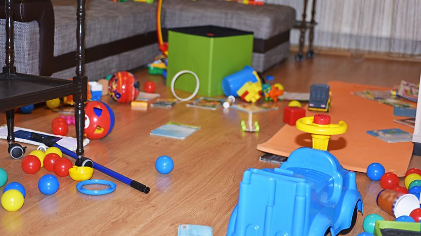 A room full of toys on the floor.