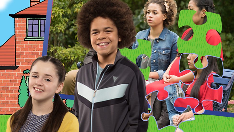 Chloe and Jay from the Dumping Ground in front of a Dumping Ground jigsaw.