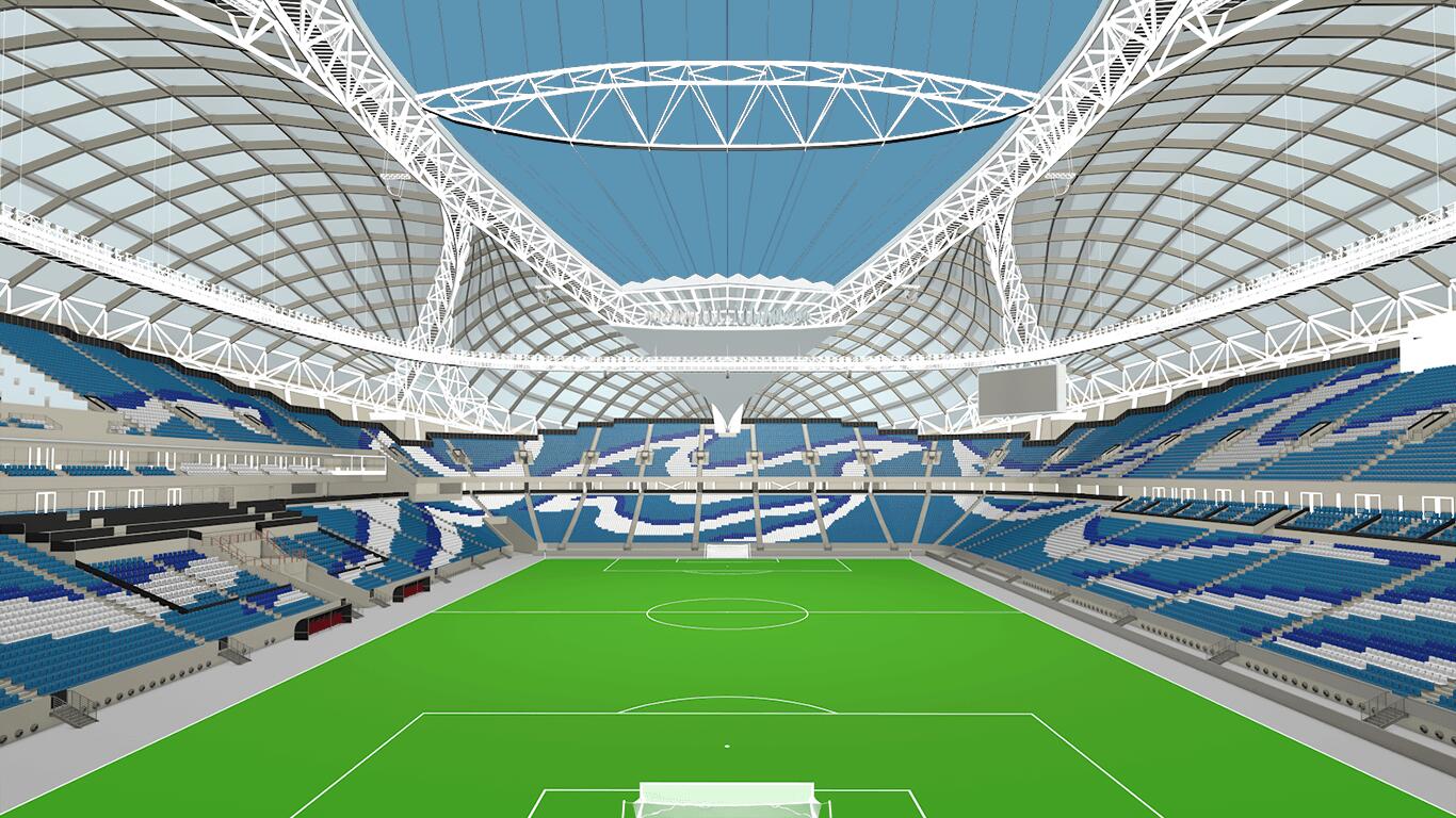 View of the interior of the Al Janoub Stadium showing the pitch and spectator area