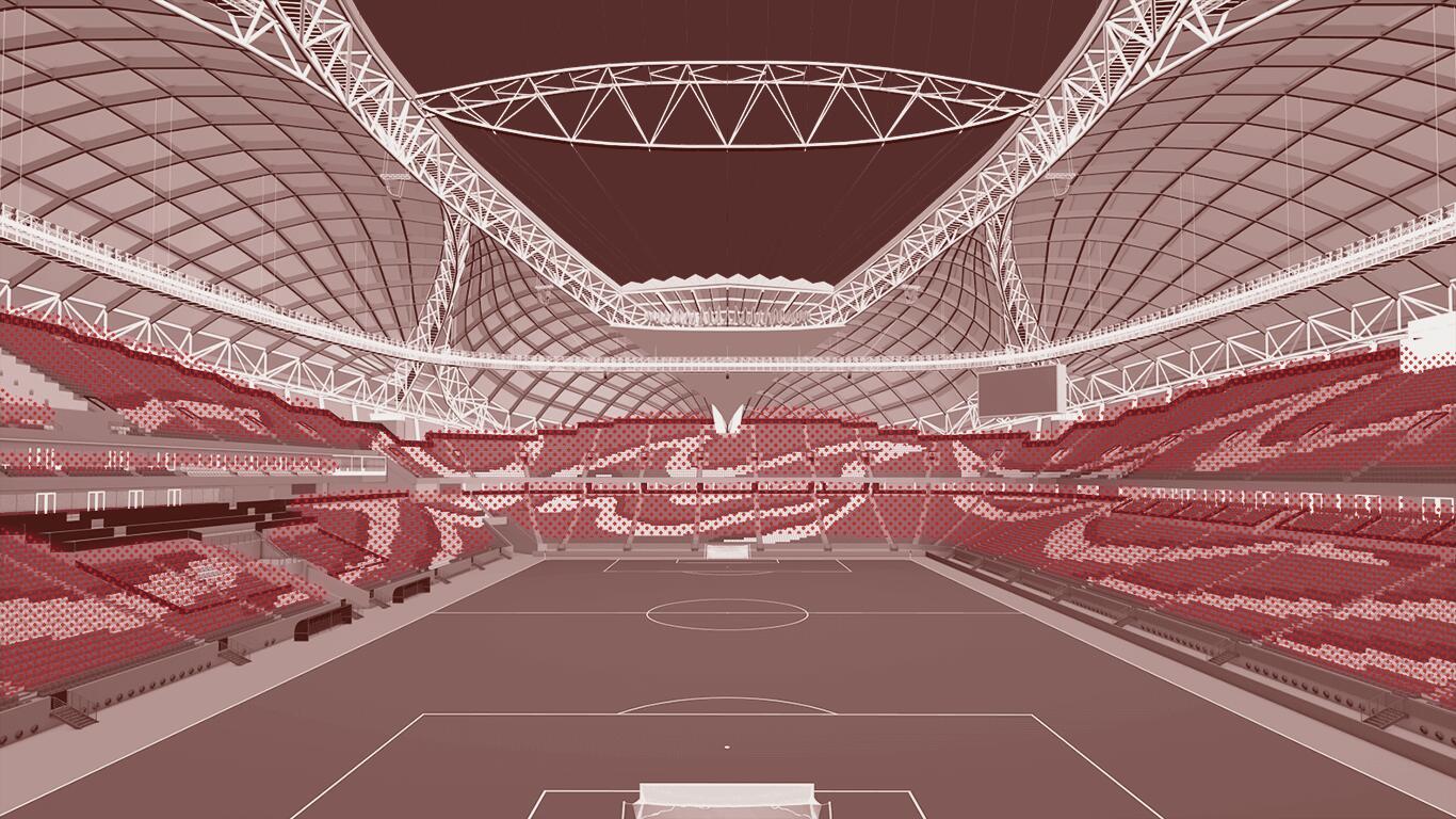 View of di interior of di Al Janoub Stadium showing di pitch and highlighting di heat for di spectator area in deep red shade