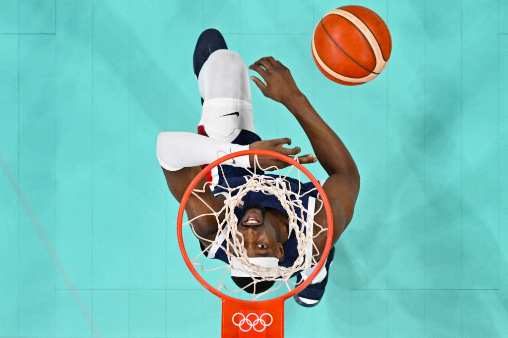 USA's Bam Adebayo goes for a rebound in the men's preliminary round group C basketball match with Serbia