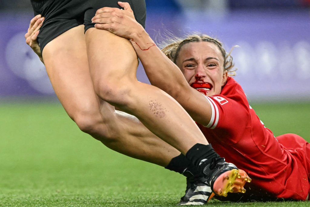 Canada's Krissy Scurfield tackles New Zealand's Jazmin Felix-Hotham during a rugby sevens match 