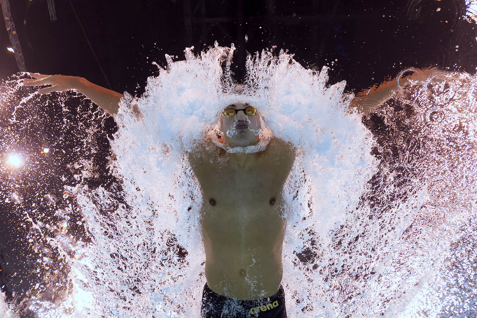 An underwater view shows Bulgaria's Petar Petrov Mitsin competing in a heat of the men's 200m butterfly swimming